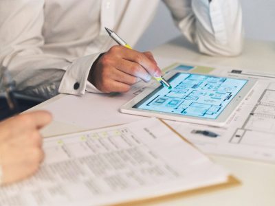 crop-people-working-with-plans-tablet